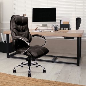 black leather executive office chair in black leather in room shot in front of office desk