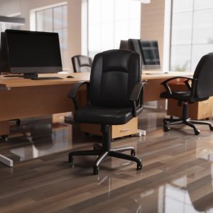 black leather office chair in front of office desks room shot