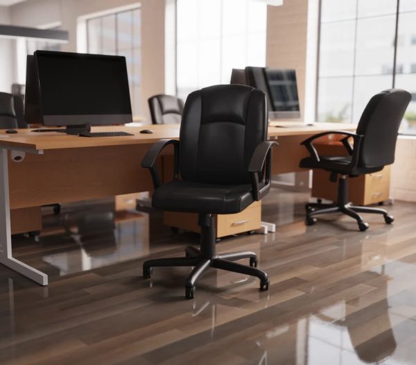 black leather office chair in front of office desks room shot