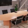 design classic meeting chair in black leather around a rounded end meeting table