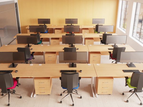 ergonomic medium back office chair in room shot in rows of office desks