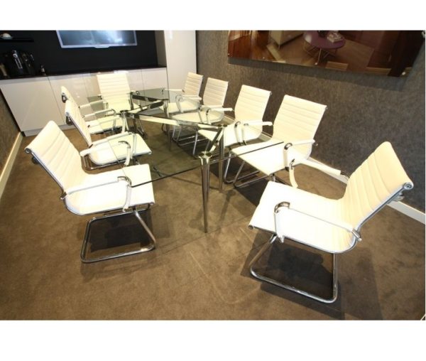 glass meeting table with chrome frame in meeting room with cream meeting room chairs