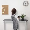 height adjustable desk chrome frame. lady standing working at sit stand desk