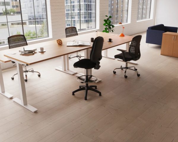 height adjustable desks in office shot with office chairs