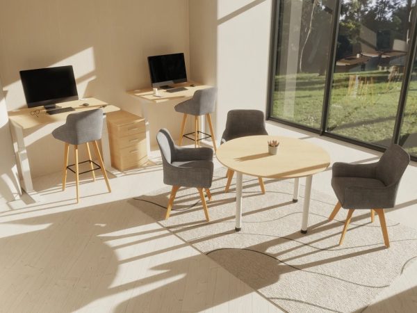 height adjustable desk in room shot with coffee table and office chairs