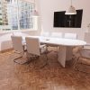 medium back white leather cantilever frame visitor chair in room shot around meeting table