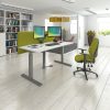 office chair in contemporary white room set with height adjustable desk and green desk screen