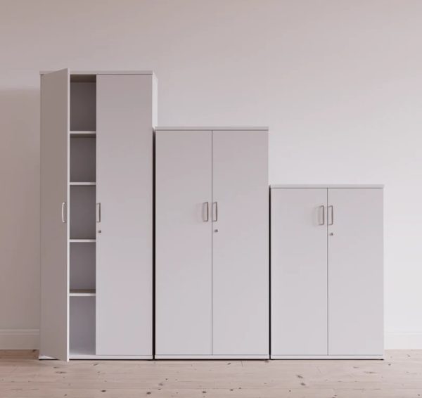 3 white office cupboards different heights in a row.