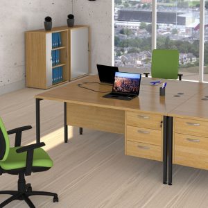 office desk with H frame leg in oak finish in roomset
