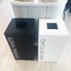 office recycling bins in white and black finish in front of retail unit.