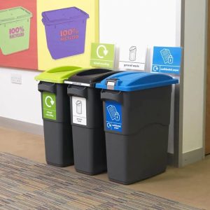 3 dark greay office recycling bins with recycling stickers and signage
