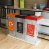 office recycling bins transparent in row of three with coloured tops and stickers for different waste streams