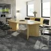 radial boardroom table in beech in meeting room set with black meeting chairs