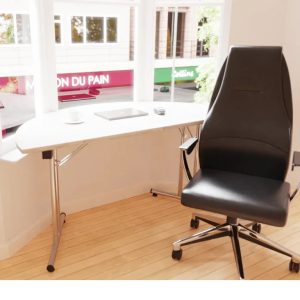 semi circular meeting table in window with black office chair