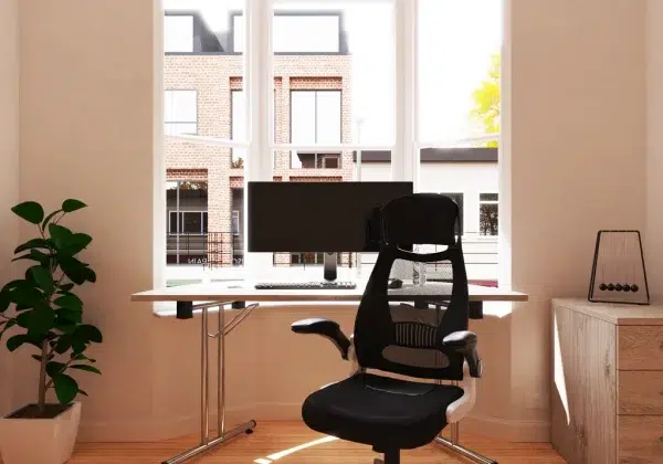 semi circular meeting table in window with black office chair