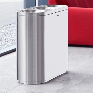 stainless steel office recycling bin with 3 apertures in reception with red sofa