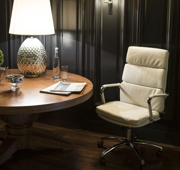 white leather office chair with chrome frame in room shot by round table