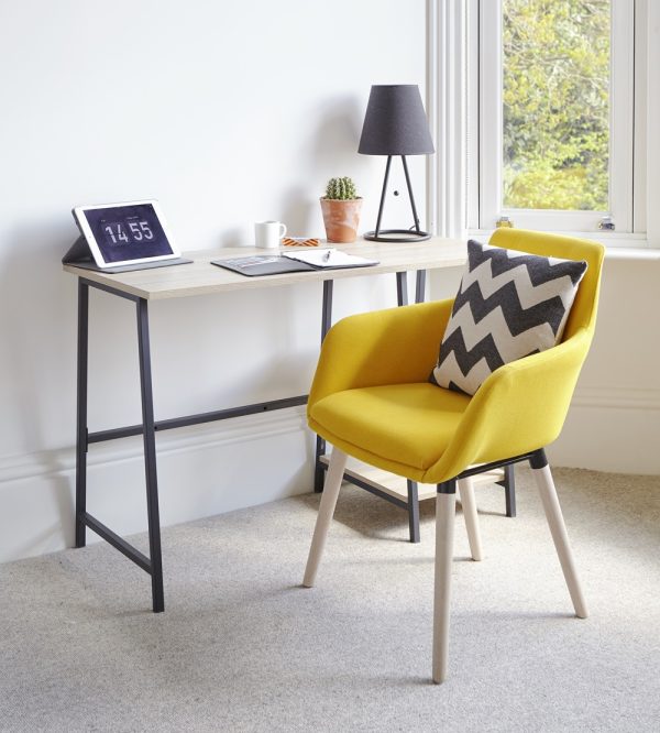 yellow fabric chair in front of home office desk in room set