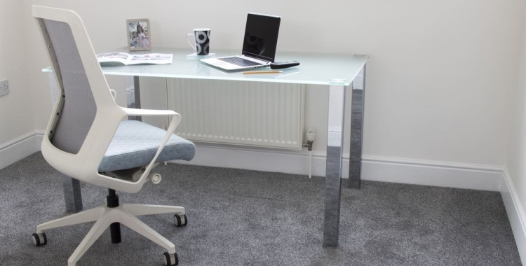 glass desk with chrome frame and white office chair