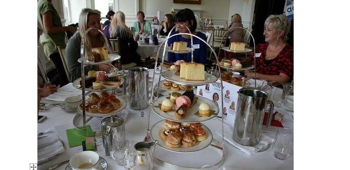 Ladies having afternoon tea networking