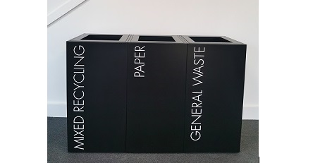 row of 3 black office recycling bins with white lettering Mixed Recycling , Paper and General Waste