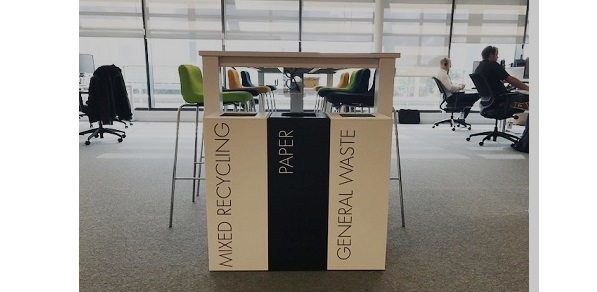 row of 3 office recycling bins in office. 1 white bin with black lettering Mixed Recycling, 1 Black bin with white lettering paper and 1 bin black lettering general waste