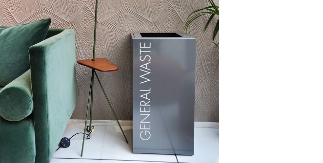 grey office recycling bin by reception sofa