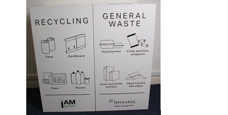 White office recycling bins with black lettering and graphics