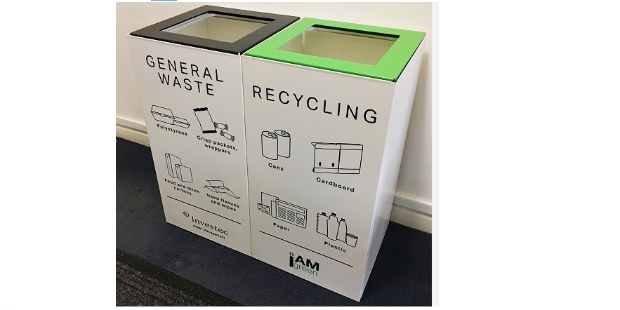 office recycling bins with white body and green and black tops. Large pictogram sticker to indicate waste streams