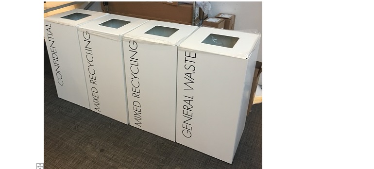 row of white office recycling bins