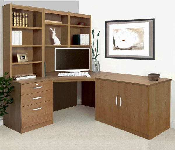 home office furniture in english oak. Includes a corner desk, office cupboard, drawers and shelving hutch