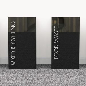 office recycling bins in a row. Black bins with white lettering