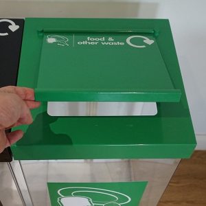 food waste bin showing close up of lift up lid in green