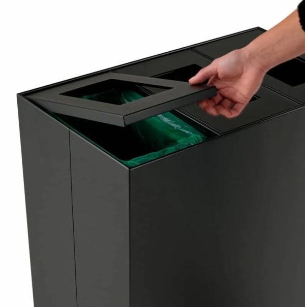 office recycling bin close up of someone lifting the hinged lid