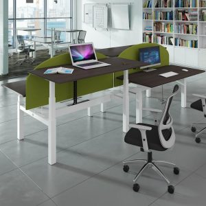 room set with contemporary office chair. With height adjustable desks and green desk screens