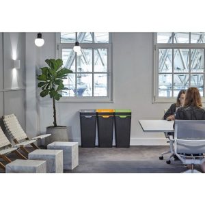 people sat at meeting table in office with 3 office recycling bins. Grey body and different coloured tops for different waste