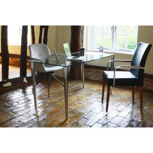 contemporary glass desk in home office room shot with 2 office chairs