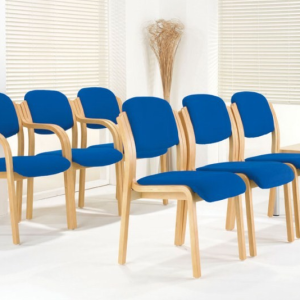 blue fabric meeting chairs with wooden frame in 2 rows room shot