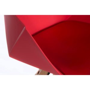 close up of red cafe chair with wooden legs