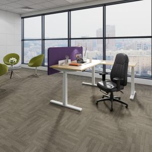 standing office desk in office with purple desk screen and office chair with city view